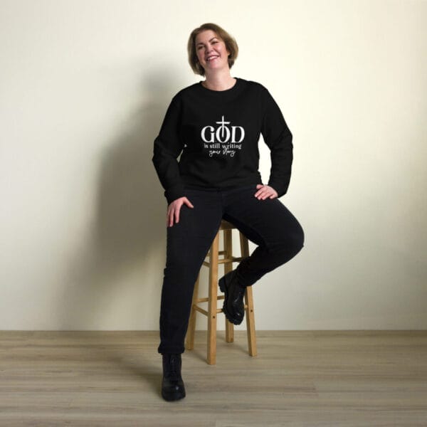 God is still writing... Unisex organic sweatshirt